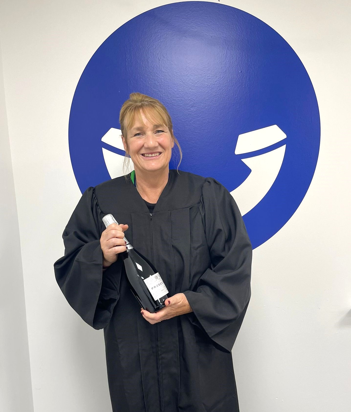 A member of the Face For Business team celebrating gaining a qualification